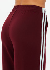 THE UPSIDE women's merlot Vitesse Marine Wide Leg Pant is a high rise fit and features a elasticated waistband, drawcord and side seam pockets in slinky fabrication. Made for lifestyle.