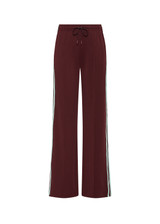 THE UPSIDE women's merlot Vitesse Marine Wide Leg Pant is a high rise fit and features a elasticated waistband, drawcord and side seam pockets in slinky fabrication. Made for lifestyle.