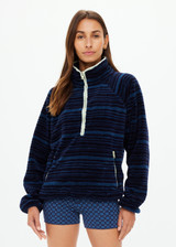 THE UPSIDE women's blue stripe Harlow Fleece Pullover is designed for a relaxed fit and features zip pockets and elasticated waist and cuffs. Made for lifestyle.