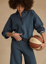THE UPSIDE women's blue organic cotton Lumiere Zane Knit Collared Top is designed for a relaxed fit and features a geometric star design. Made for lifestyle.