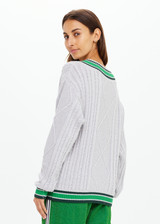 THE UPSIDE women's grey marle organic cotton Josette V Neck Knit Sweater is a regular fit and features cable detailing through front and a green striped neckline. Made for lifestyle.