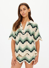 THE UPSIDE women's green organic cotton Tidal Sagra Crochet Shirt is designed for a relaxed fit and features tortoiseshell buttons at opening. Made for everyday leisure.