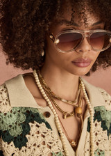 THE UPSIDE women's green organic cotton Tidal Sagra Crochet Shirt is designed for a relaxed fit and features tortoiseshell buttons at opening. Made for everyday leisure.