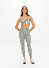 THE UPSIDE women's green Reversible 25inch Legging is designed for a soft & supportive fit in a recycled fabric and features embroidered arrow logo on back. Made for yoga & pilates.