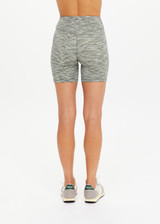 THE UPSIDE women's green Reversible 5inch Spin Short is designed for a soft & supportive fit in a recycled fabric and features embroidered arrow logo on back. Made for yoga & pilates.