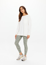 THE UPSIDE women's cream recycled cotton Soho Cara Long Sleeve Top is designed for a relaxed fit and features a ribbed neck and cuffs and a patch pocket at front. Made for everyday leisure.