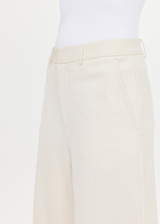 THE UPSIDE women's cream pinstripe Orion Mira Wide Leg Pant is a true-to-size fit and features a flat waistband with belt loops and side pockets. The perfect wardrobe essential.
