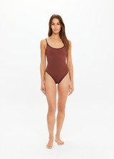 THE UPSIDE women’s chocolate brown Banya Flow classic One Piece swimsuit is made from recycled fabric and features a scoop front and back neckline, high shaped legline and adjustable straps.