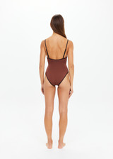 THE UPSIDE women’s chocolate brown Banya Flow classic One Piece swimsuit is made from recycled fabric and features a scoop front and back neckline, high shaped legline and adjustable straps.