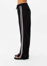 THE UPSIDE women's black Roma Pant is high-waisted with a elasticated waistband with drawcord, contrast cream stripes down sides and front & back pockets. The perfect everyday pant.