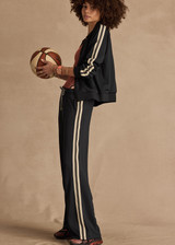 THE UPSIDE women's black Empire Marnie Wide Leg Pant is high-waisted and features a elasticated waistband with drawcord and side pockets. Made for lifestyle.