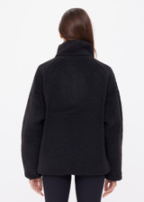 THE UPSIDE women's black Harlow Fleece Pullover offers a relaxed fit made from recycled warm fleece fabric and features zip pockets and an elastic at waist and cuffs to keep warmth in. Made for lifestyle.