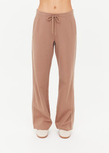 THE UPSIDE women's mocha Jetset Pant is designed for a regular fit and features an elasticated waist with a drawcord and front and back packets. The perfect everyday pant.