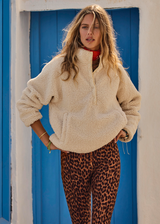 THE UPSIDE women's natural Harlow Fleece Pullover offers a relaxed fit made from recycled warm fleece fabric and features zip pockets and an elastic at waist and cuffs to keep warmth in. Made for lifestyle.