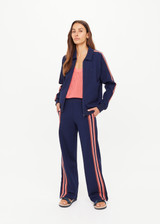 THE UPSIDE women's navy Ananda Pari Zip Jacket is a true-to-size fit and features a zip-through front, front pockets and knitted stripes down sleeves. The perfect everyday piece.