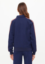THE UPSIDE women's navy Ananda Pari Zip Jacket is a true-to-size fit and features a zip-through front, front pockets and knitted stripes down sleeves. The perfect everyday piece.