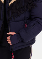 THE UPSIDE women's navy Hakuba Fox Puffer Jacket is a true-to-size fit, featuring a water-resistant coating, fringed detailing, fleece-lined zip pockets and an adjustable elastic at hem. Designed for Après-ski and winter wear.