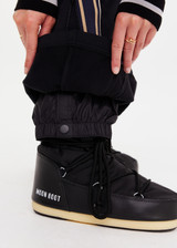 THE UPSIDE women's black Hakuba Petra Zip Flare is a true-to-size fit and offers high water repellency, high breathability and bonded fleece underside for extra warmth. Designed for Après-ski and winter wear.