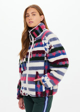THE UPSIDE women’s Harlow Fleece Zip Through in multi star design features a relaxed fit, contrast woven binds, and a zip chest pocket. Made for everyday wear.