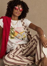 THE UPSIDE women's organic cotton creme Feeling Lucky Jodhi Tee features a classic shape and Feeling Lucky graphic printed on the front chest. Made for everyday wear.