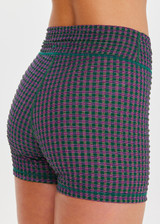 THE UPSIDE women's check Aliki 3inch Spin Short features a mid-rise fit, elastic drawcord in a textured green gingham fabric. Made for Pilates and yoga.