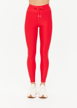 THE UPSIDE women's red eco tech Oxford 25-inch Legging is supportive and comfortable with cream side stripes and an elastic waist drawcord. Made for high impact.