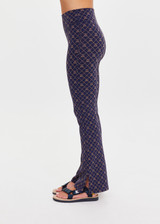 THE UPSIDE women's monogram jacquard Ezra Florence Flare is high-rise with a firm & supportive fit, featuring a V panel waistband and side seam split at hem. Made for yoga and pilates.