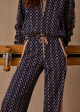 THE UPSIDE women's jacquard Ezra Nova Flare Pant features a monogram geometric design and an elasticated waistband with drawcord. Made for lifestyle.