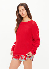 THE UPSIDE women's red organic cotton Fenway Sebastion Knit Crew has a relaxed fit with ribbed neckline and cuffs, and a logo knit detail on the back. Made for everyday wear.