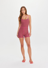 THE UPSIDE women's pink check Aliki Kiva Bodysuit features elastic straps, low cross back, and inner shelf bra with removable cups. Made for yoga and pilates.