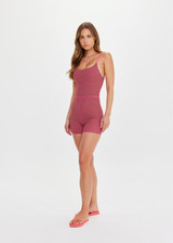 THE UPSIDE women's pink check Aliki Kiva Bodysuit features elastic straps, low cross back, and inner shelf bra with removable cups. Made for yoga and pilates.