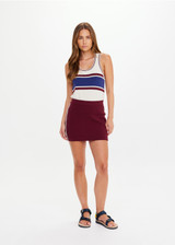 THE UPSIDE women’s recycled maroon Adesa Zelma Knit Mini Skirt features a cream stripe along the side. Made for lifestyle.