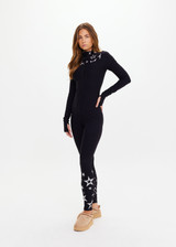 THE UPSIDE women’s black Superstar Nova Jumpsuit offers a firm & supportive fit in our jacquard stretch fabrication and features a mock neck zip through and thumb holes. Designed for Après-ski and winter wear.