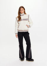THE UPSIDE women’s cream Swiss Dhemi Knit Jacket features a zip through opening, removable sleeves and is lined with polar fleece. Designed for Après-ski and winter wear.