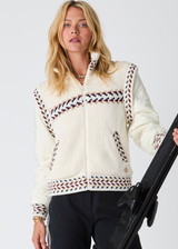 THE UPSIDE women’s cream Swiss Dhemi Knit Jacket features a zip through opening, removable sleeves and is lined with polar fleece. Designed for Après-ski and winter wear.