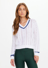 THE UPSIDE women’s white Citta Sonny V Neck Sweater is a fitted, chevron-knit design in organic cotton. The perfect wardrobe addition.
