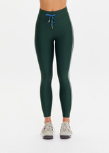 THE UPSIDE women’s recycled green Maneki 25In Legging features quick-dry fabric, contrast blue and butter side binds, and an elastic drawcord waist. Made for yoga and pilates.