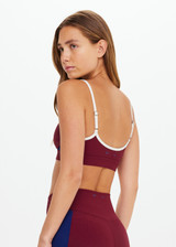 THE UPSIDE women’s maroon Adesa Scoop Danni Bra in recycled rib features scoop front and back necklines, removable cups, and soft elastic underbust. Made for high impact.