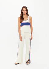 THE UPSIDE women’s creme recycled rib Adesa Vilde Knit Tank Top features a scoop neckline and small side slits at the hem. Made for everyday wear.