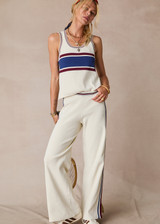 THE UPSIDE women’s creme recycled rib Adesa Vilde Knit Tank Top features a scoop neckline and small side slits at the hem. Made for everyday wear.