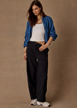 THE UPSIDE women’s black recycled fabric Estelle Barrel Pant is designed for a boxy fit and features a structured waistband with belt loops and side seam pockets. Made for everyday.