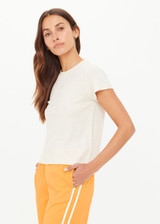 THE UPSIDE women's creme organic cotton The 70's Tee features a rib neckline and classic 70s-inspired style. Made for everyday wear.