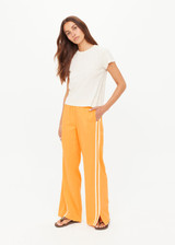 THE UPSIDE women's creme organic cotton The 70's Tee features a rib neckline and classic 70s-inspired style. Made for everyday wear.