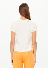 THE UPSIDE women's creme organic cotton The 70's Tee features a rib neckline and classic 70s-inspired style. Made for everyday wear.