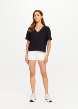 THE UPSIDE women's black Elina V Neck Tee is made from organic cotton hemp blend. This v neck boxy t-shirt features a mini patch pocket at the chest and is designed for everyday wear.