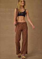 THE UPSIDE women's leopard organic cotton Malawi Freya Knit Pant is true-to-size and features a elasticated waistband with drawcord and short splits at hem. Made for everyday.