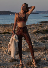 THE UPSIDE women's leopard Malawi 25inch Midi Pant offers soft & supportive fit and features a orange and navy striped drawcord in our recycled peached fabrication. Made for yoga & pilates.