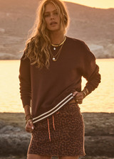 THE UPSIDE women's brown organic cotton Toluca Lisel Crew Neck Sweater offers a relaxed fit with a dropped shoulder and features a ribbed neckline and cuffs. Made for lifestyle.