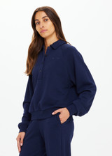 THE UPSIDE women's navy organic cotton Collared Elle Polo is a relaxed long sleeve polo featuring buttons on front. Made for everyday.