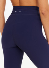 THE UPSIDE women's navy recycled peached Maison 25inch Midi Pant is mid-rise and features cream scalloped edge trim at hem. Made for yoga & pilates.